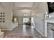 Inviting dining room with elegant chandelier, large windows, and open layout, ideal for entertaining guests at 7040 Shady Oak Ln, Cumming, GA 30040