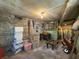 Unfinished basement with concrete floor, stone walls, and exposed ceiling at 1368 Scott Blvd, Decatur, GA 30030