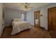 Bedroom with wood floors, ceiling fan and door with mirror at 1368 Scott Blvd, Decatur, GA 30030
