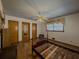 Hardwood-floored bedroom featuring a classic wood-framed bed, two closets, and elegant patterned window curtains at 1368 Scott Blvd, Decatur, GA 30030