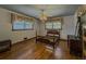 Hardwood floors and classic windows create an elegant ambiance in this bedroom with traditional wood frame bed at 1368 Scott Blvd, Decatur, GA 30030