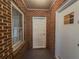 The entryway features a solid brick wall and a storm door for added security and weather protection at 1368 Scott Blvd, Decatur, GA 30030