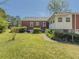 An exterior view of the home's side yard featuring a walkway and grassy area at 1368 Scott Blvd, Decatur, GA 30030