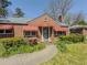 Inviting brick home entrance with a unique front door and well-maintained landscaping at 1368 Scott Blvd, Decatur, GA 30030