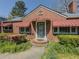 Inviting brick home entrance with a unique front door and well-maintained landscaping at 1368 Scott Blvd, Decatur, GA 30030