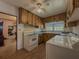Kitchen with wood cabinets, laundry, and eat-in area at 1368 Scott Blvd, Decatur, GA 30030