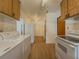 Kitchen with laundry area and wood cabinets at 1368 Scott Blvd, Decatur, GA 30030