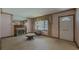 Cozy living room featuring a fireplace, mantel mirror, and natural light from the window at 1368 Scott Blvd, Decatur, GA 30030