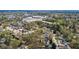 Wide aerial shot of a neighborhood, showcasing lush greenery, nearby amenities, and a vibrant community at 312 Meadow Dr, Alpharetta, GA 30009