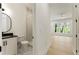 Charming bathroom with decorative tile, shower, and view to the bright bedroom at 312 Meadow Dr, Alpharetta, GA 30009