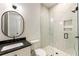 Elegant bathroom with marble shower, black fixtures, and stylish vanity at 312 Meadow Dr, Alpharetta, GA 30009