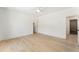 Bright bedroom featuring light hardwood floors, white walls, and a ceiling fan with a light at 312 Meadow Dr, Alpharetta, GA 30009