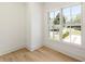 A bright room with hardwood floors, a window, and a view to the street at 312 Meadow Dr, Alpharetta, GA 30009