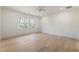Bedroom featuring hardwood floors, large window, and white walls at 312 Meadow Dr, Alpharetta, GA 30009