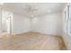 A spacious, bright bedroom with hardwood floors and a large window for natural light at 312 Meadow Dr, Alpharetta, GA 30009