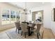 Bright dining room featuring modern decor, comfortable seating, and plenty of natural light from expansive windows at 312 Meadow Dr, Alpharetta, GA 30009