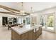Spacious kitchen island featuring marble countertops and modern lighting is showcased in this open-concept home at 312 Meadow Dr, Alpharetta, GA 30009