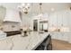 Gourmet kitchen featuring marble countertops, a spacious island, and professional-grade appliances at 312 Meadow Dr, Alpharetta, GA 30009