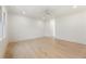 Bright living room featuring hardwood floors, ceiling fan, and recessed lighting at 312 Meadow Dr, Alpharetta, GA 30009
