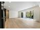 Bright living room with hardwood floors and folding doors to outdoor pool at 312 Meadow Dr, Alpharetta, GA 30009