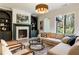 Inviting living room featuring built-in bookshelves, a marble fireplace, and comfortable seating arrangement at 312 Meadow Dr, Alpharetta, GA 30009