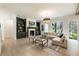 Bright living room with built-in bookshelves, modern fireplace, and large windows providing natural light at 312 Meadow Dr, Alpharetta, GA 30009