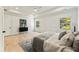 Relaxing main bedroom with hardwood floors, tray ceilings, a ceiling fan, and decorative trim work at 312 Meadow Dr, Alpharetta, GA 30009
