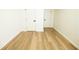 Bright basement space with modern flooring and white trim, perfect for a home office or recreation area at 4336 Parkview Dr, Lithia Springs, GA 30122