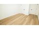 Finished basement space with sleek flooring and neutral tones, offering a clean and modern aesthetic at 4336 Parkview Dr, Lithia Springs, GA 30122