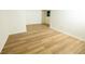 Finished basement offers ample space with wood-look flooring, creating a versatile area for various uses at 4336 Parkview Dr, Lithia Springs, GA 30122