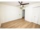 Bedroom with wood grain floors, ceiling fan, closet, and freshly painted white walls at 4336 Parkview Dr, Lithia Springs, GA 30122