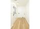Laundry room with wood grain floors, wainscoting, and an updated exterior door at 4336 Parkview Dr, Lithia Springs, GA 30122
