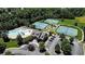 Aerial view of the community center, including a pool, water park, playground, tennis courts, and parking at 6015 Crestwick Way, Cumming, GA 30040