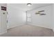Bedroom features white walls, carpet flooring, and a window for natural light at 6015 Crestwick Way, Cumming, GA 30040