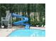 Community pool with water slide, staircase, and lifeguard chair, surrounded by lounge chairs and grassy areas at 6015 Crestwick Way, Cumming, GA 30040