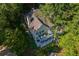 Aerial view of a beautiful home showcasing the expansive deck and lush surroundings at 1187 Plantation Dr, Villa Rica, GA 30180