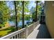Lovely back deck with a view of the lake and a staircase leading to a lake view at 1187 Plantation Dr, Villa Rica, GA 30180