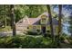 Beautiful home with lush greenery, a well-maintained lawn, and scenic lake views at 1187 Plantation Dr, Villa Rica, GA 30180