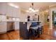 Stylish kitchen with a gray island, barstool seating, stainless steel appliances, and ample counter space at 1187 Plantation Dr, Villa Rica, GA 30180