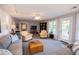 Spacious living room with comfortable seating, a TV, a ceiling fan, and access to an outdoor deck at 1187 Plantation Dr, Villa Rica, GA 30180