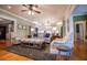 Open-concept living room with hardwood floors and a view of the updated kitchen and dining areas at 1187 Plantation Dr, Villa Rica, GA 30180