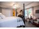 Bright main bedroom with a four-poster bed, ample natural light, and generous closet space at 1187 Plantation Dr, Villa Rica, GA 30180