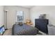 Comfortable bedroom featuring a large window, neutral walls, and a cozy bed with stylish bedding at 1901 Creel Ln, Atlanta, GA 30349