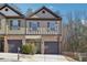 Charming townhome with a brick facade, private garage, and well-maintained landscaping at 1901 Creel Ln, Atlanta, GA 30349