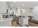 Bright kitchen featuring stainless steel appliances, granite countertops, gray cabinets, and a breakfast bar at 1901 Creel Ln, Atlanta, GA 30349