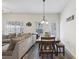 Open-concept living and dining area with hardwood floors and lots of natural light at 1901 Creel Ln, Atlanta, GA 30349