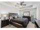 Spacious main bedroom with tray ceiling, fan, and a large window providing plenty of natural light at 1901 Creel Ln, Atlanta, GA 30349