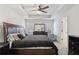 Spacious main bedroom with tray ceiling, fan, and a large window providing plenty of natural light at 1901 Creel Ln, Atlanta, GA 30349
