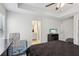 Spacious main bedroom with tray ceiling, fan, and a large window providing plenty of natural light at 1901 Creel Ln, Atlanta, GA 30349