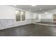 Finished basement with stone accents, large window, neutral paint, and open floor plan perfect for flexible living at 2461 Oak Grove Ne Ests, Atlanta, GA 30345